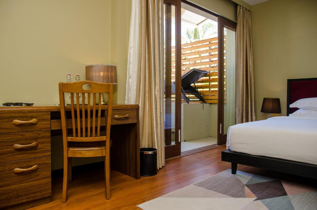 Postel nebo postele na pokoji v ubytování Fuvahmulah Central Hotel