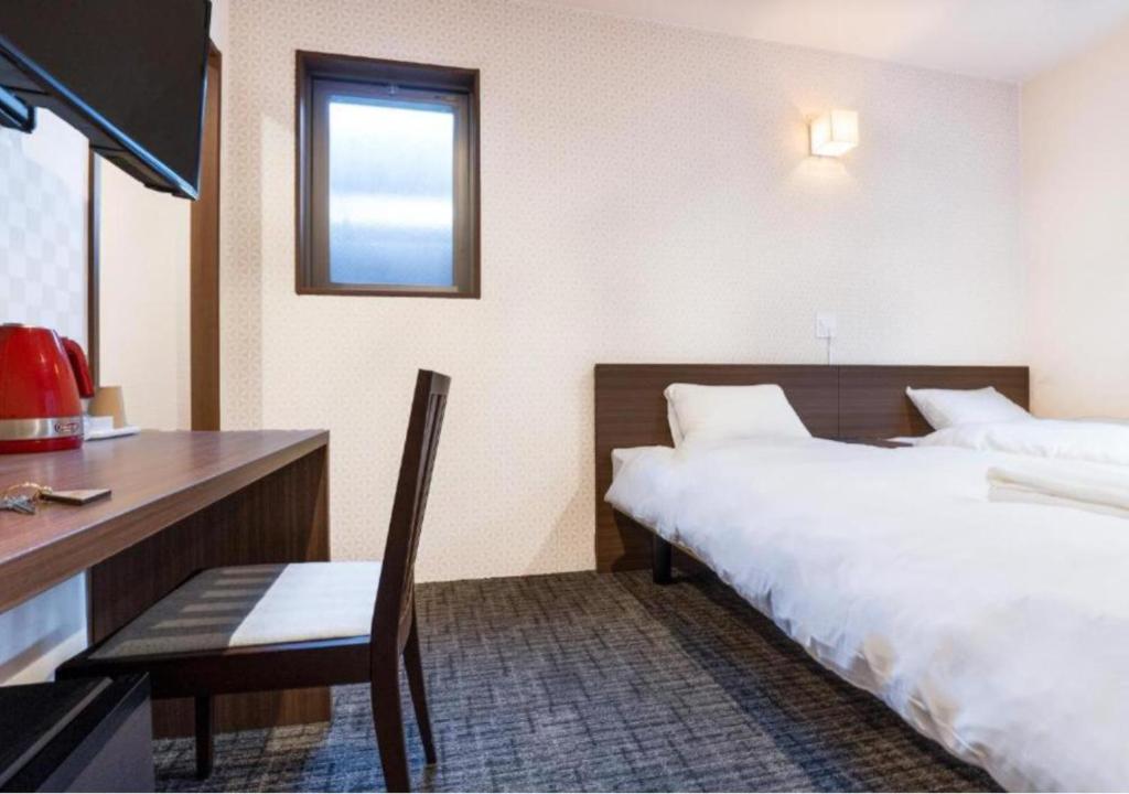 Postel nebo postele na pokoji v ubytování HOTEL DORIA