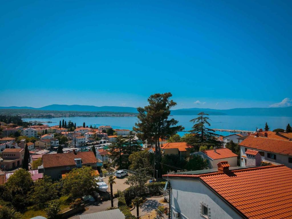 an aerial view of a town with a lake at Apartment Malinska 44 in Malinska