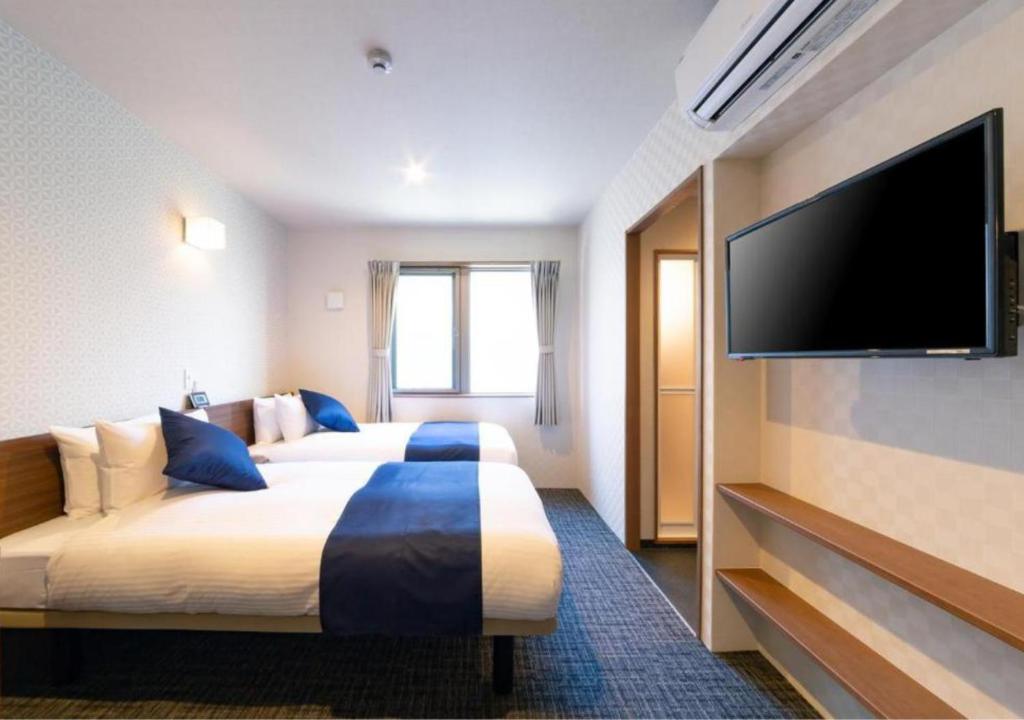 Postel nebo postele na pokoji v ubytování HOTEL DORIA
