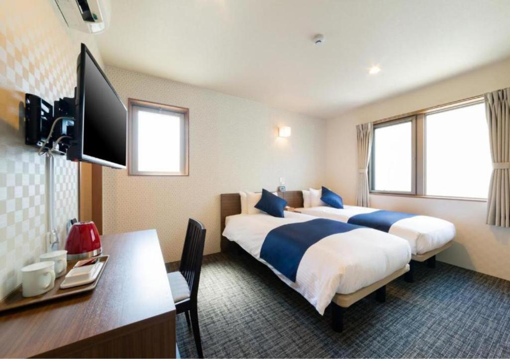 Postel nebo postele na pokoji v ubytování HOTEL DORIA