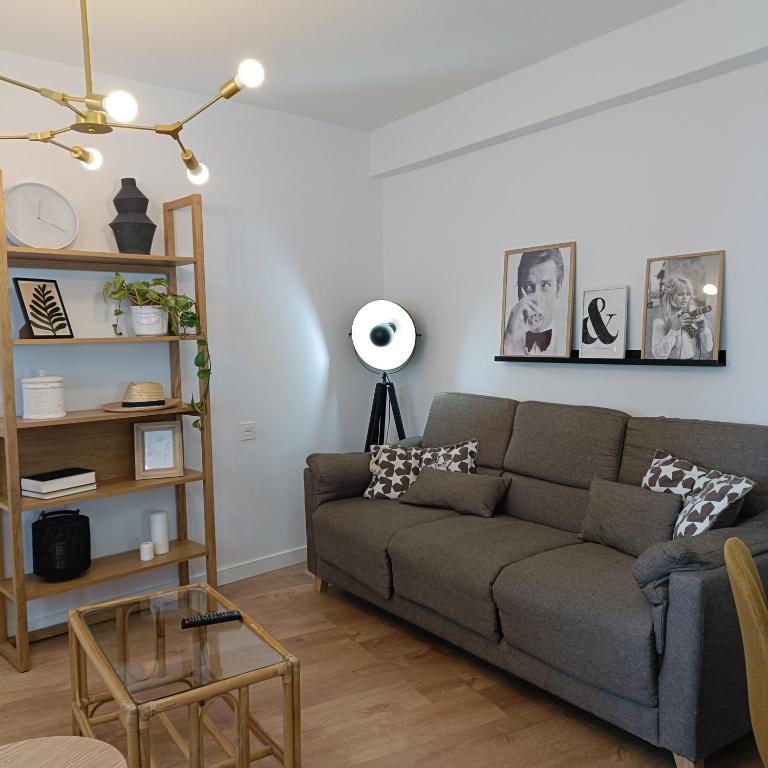 a living room with a couch and a table at Curota A in Ribeira