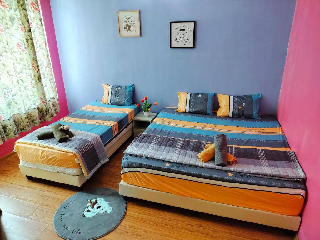 Postel nebo postele na pokoji v ubytování Idea Homestay 1