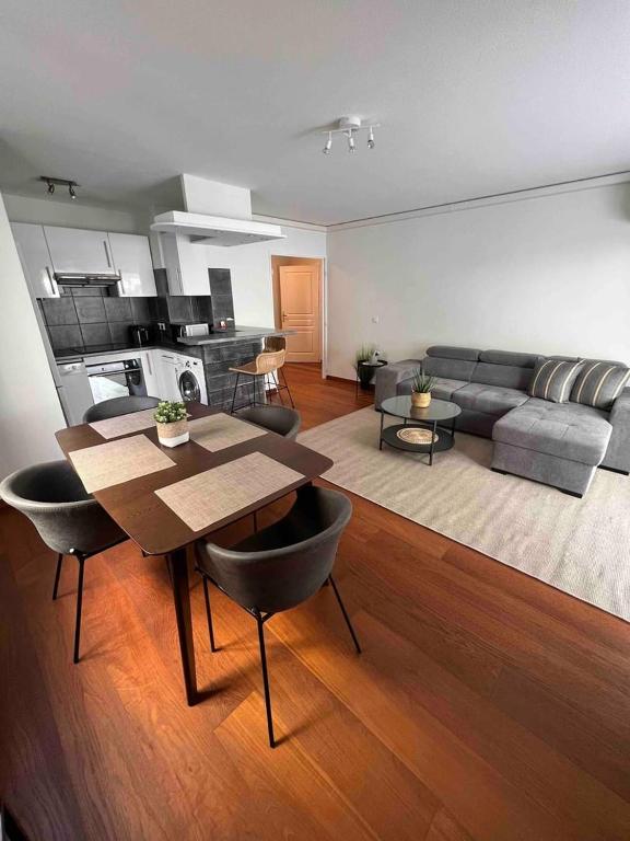 a living room with a couch and a table in it at Beautiful apartment - Centre in Cagnes-sur-Mer