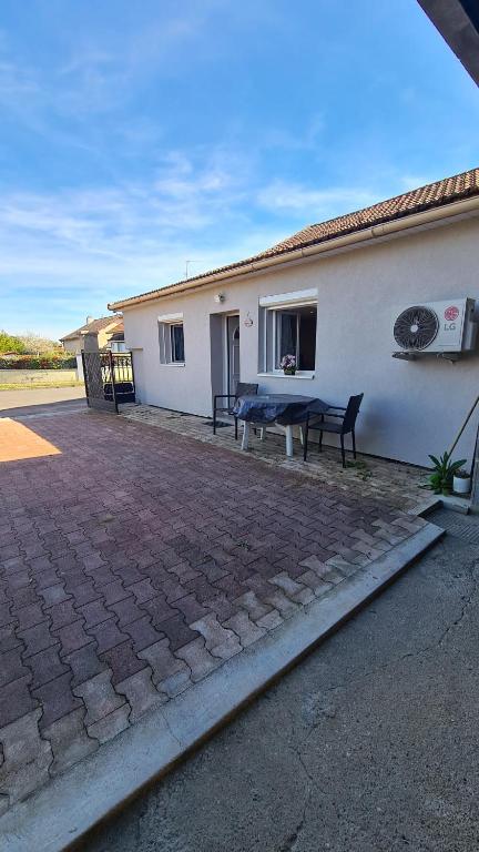a house with a ping pong table in front of it at Luxe-Home in Châtenoy-le-Royal