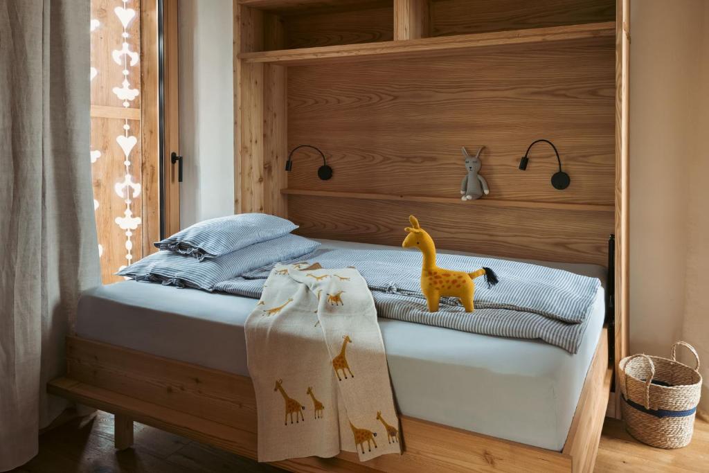 Postel nebo postele na pokoji v ubytování Am Wildbachberg - Luxus Ferienhäuser mit Infinitypool, Privatsauna und Weinkeller