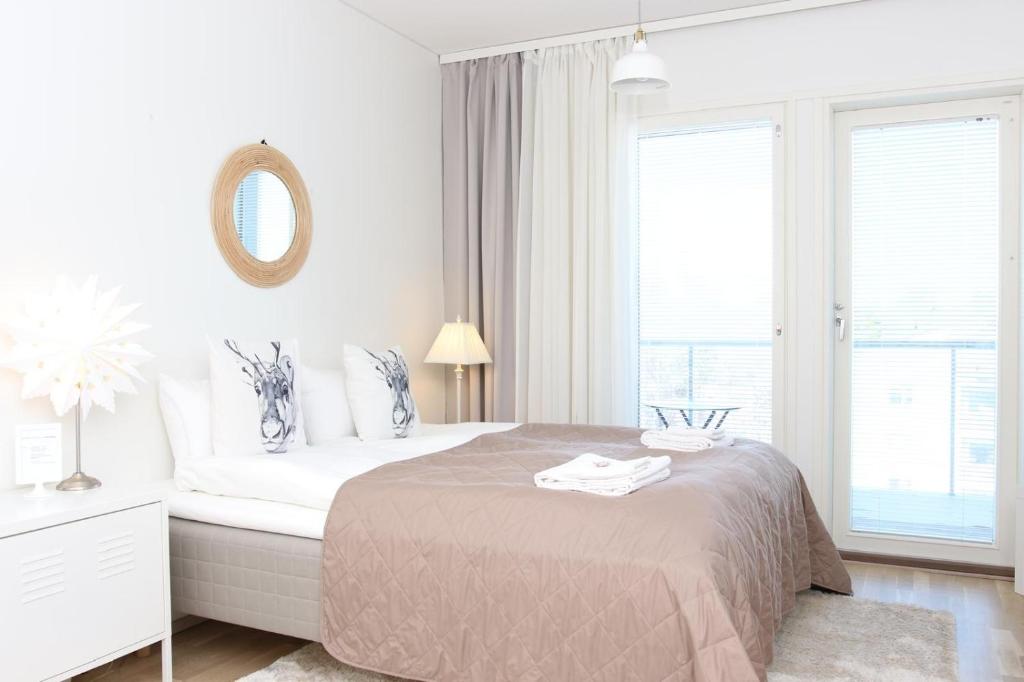 Postel nebo postele na pokoji v ubytování Arctic Suite Evakko