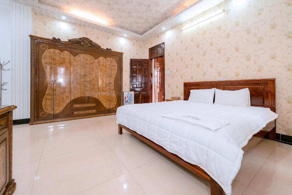 Ένα ή περισσότερα κρεβάτια σε δωμάτιο στο FGMN HOTEL Pleiku