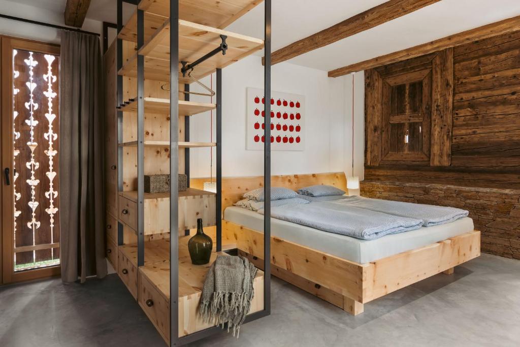 Postel nebo postele na pokoji v ubytování Am Wildbachberg - Luxus Ferienhäuser mit Infinitypool, Privatsauna und Weinkeller
