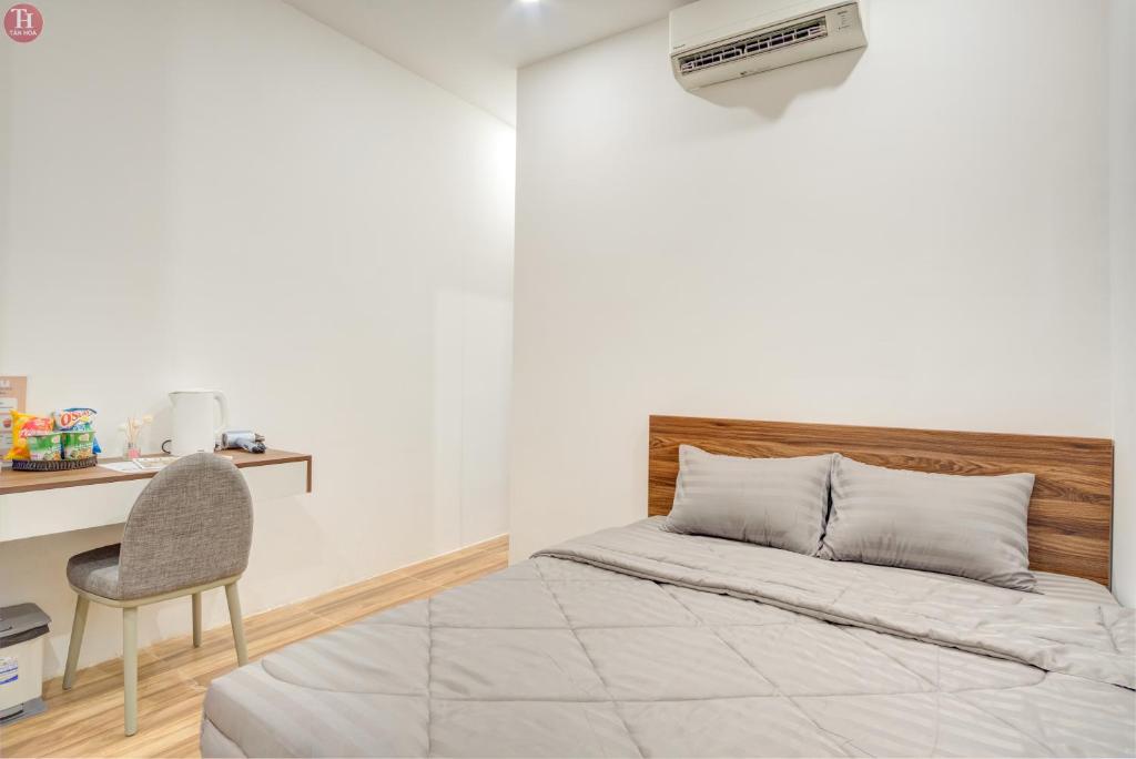 Ein Bett oder Betten in einem Zimmer der Unterkunft Tân Hoà Homestay Da Nang