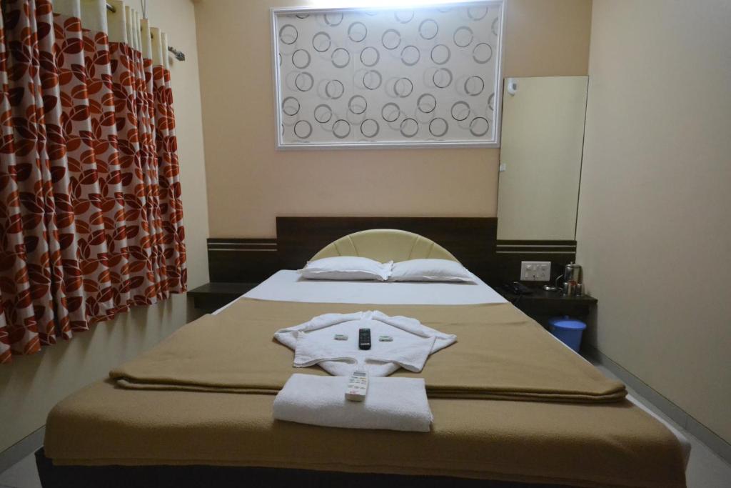 Postel nebo postele na pokoji v ubytování Hotel Yogiraj