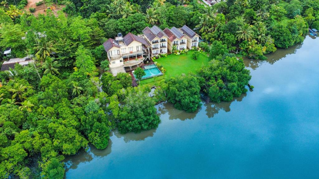 an aerial view of a house on an island in the water at Moi Koggala by DBI in Habaraduwa