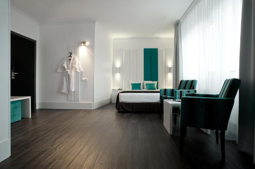 Postel nebo postele na pokoji v ubytování Hotel Ecu