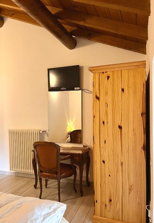 Łóżko lub łóżka w pokoju w obiekcie Agriturismo La Vecchia Chioderia