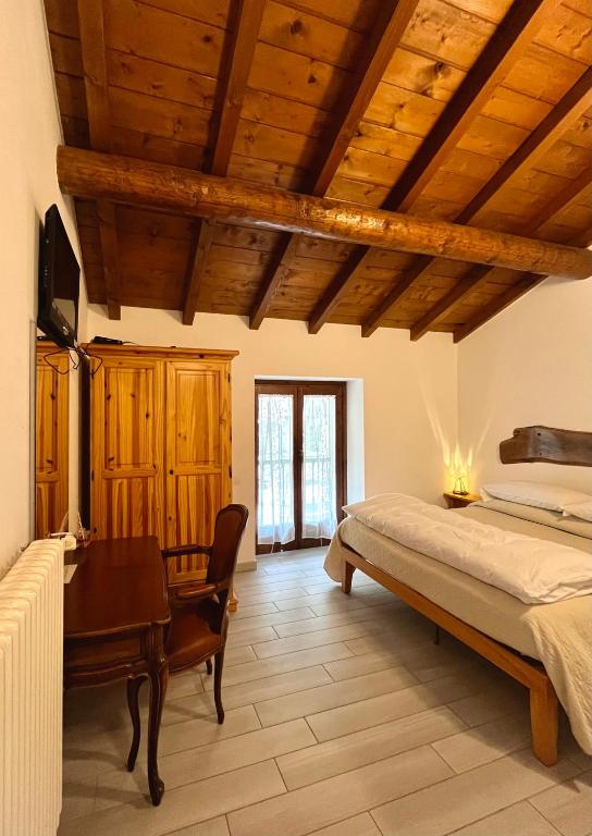Łóżko lub łóżka w pokoju w obiekcie Agriturismo La Vecchia Chioderia