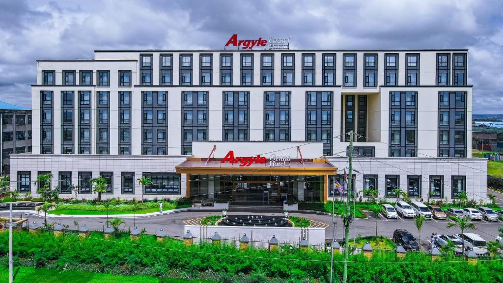 a large building with aania on the top of it at Argyle Grand Hotel Nairobi Airport in Nairobi