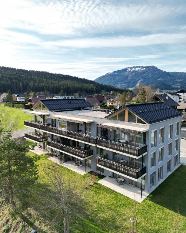an aerial view of a building with solar panels on its roof at GRIMMINGlofts in Bad Mitterndorf