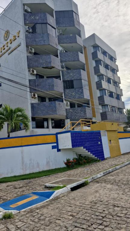a large apartment building next to a building at VICTORY FLAT-APTO 207 in Cabedelo