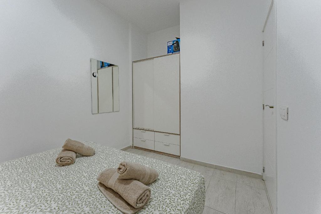 Postel nebo postele na pokoji v ubytování APARTAMENTO EN PARQUE SANTIAGO II