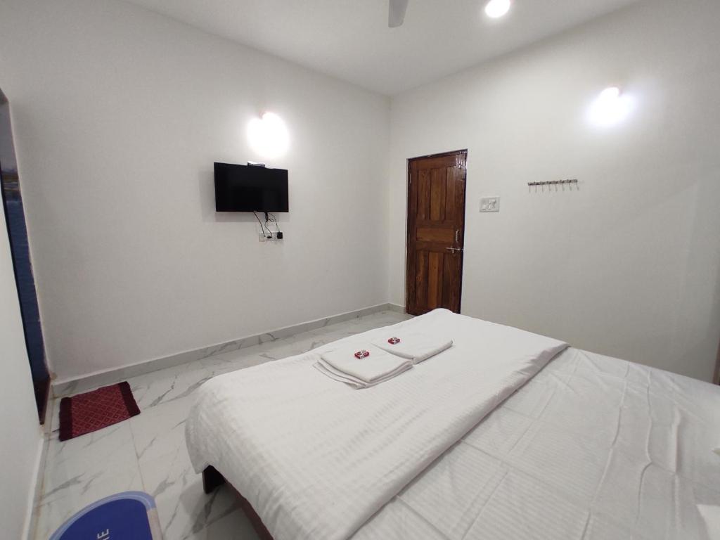 Ένα ή περισσότερα κρεβάτια σε δωμάτιο στο Sai Beach Stays