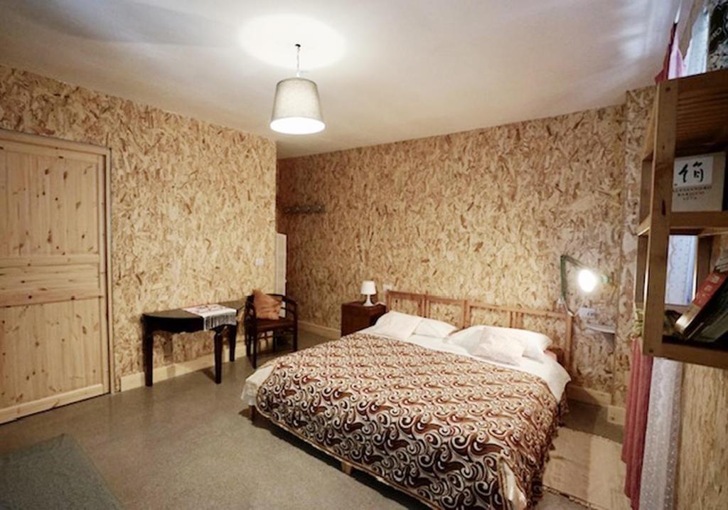 Postel nebo postele na pokoji v ubytování PODERE Sant'Anna B&B -Bambù room