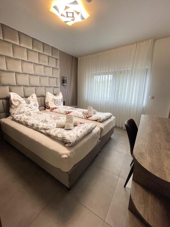 Postel nebo postele na pokoji v ubytování Hotel Löwenstein