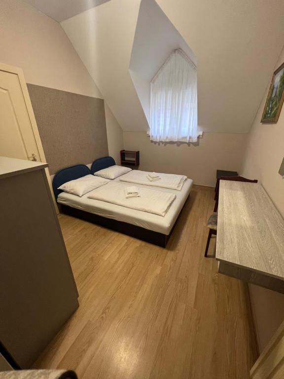 Postel nebo postele na pokoji v ubytování Piknik Wellness Hotel