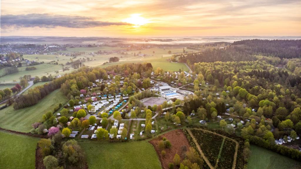 an aerial view of a park with a lot of trees at Ardennen Camping Bertrix in Bertrix