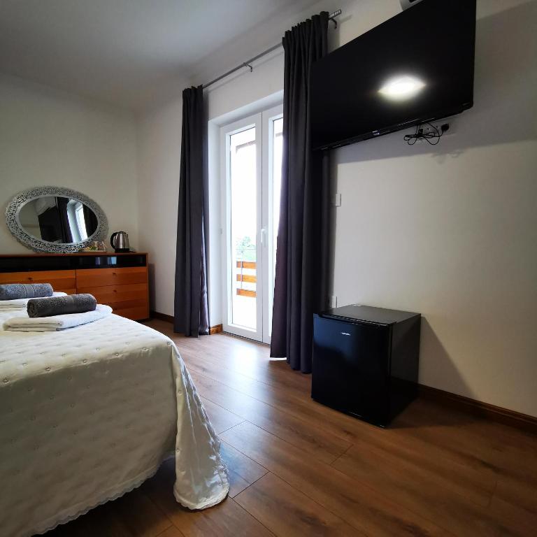 TV a/nebo společenská místnost v ubytování CASA BLANCA