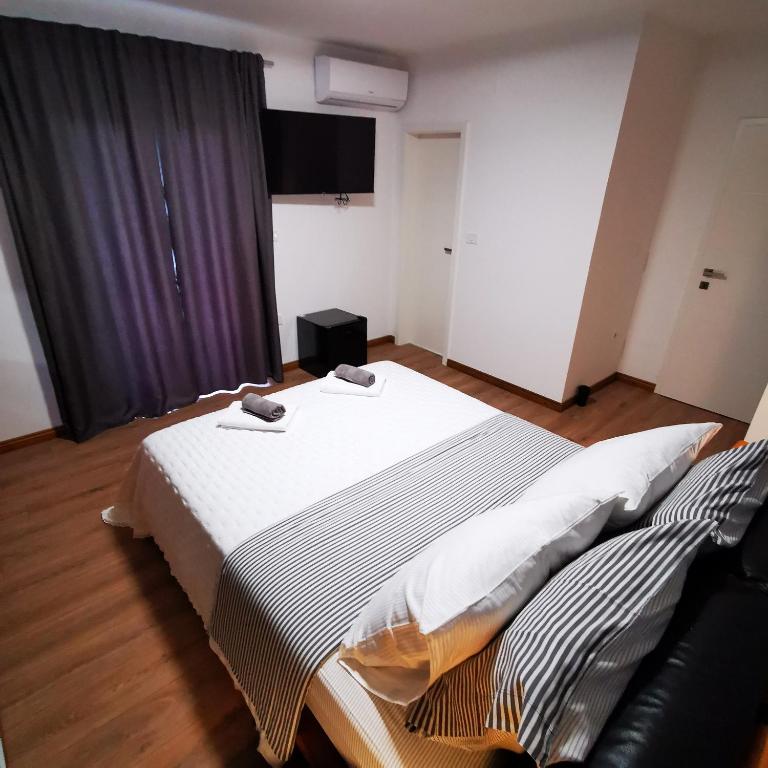 Postel nebo postele na pokoji v ubytování CASA BLANCA