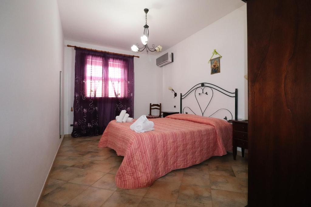Posteľ alebo postele v izbe v ubytovaní casa Vincenzo