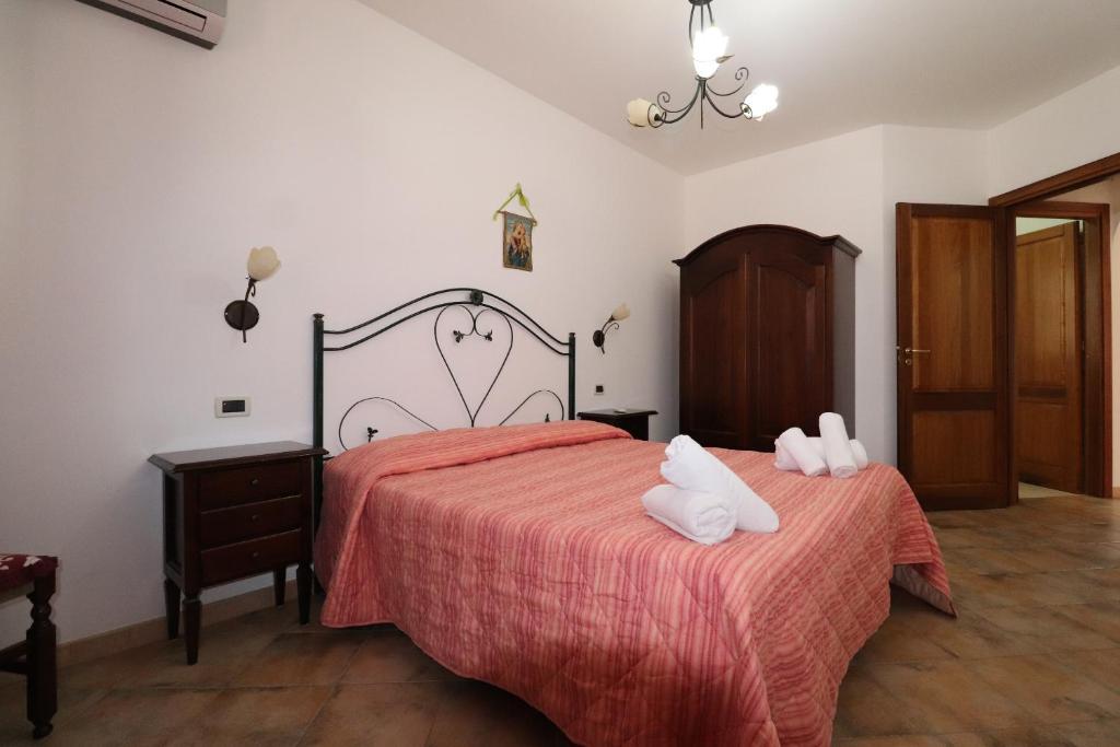 Posteľ alebo postele v izbe v ubytovaní casa Vincenzo