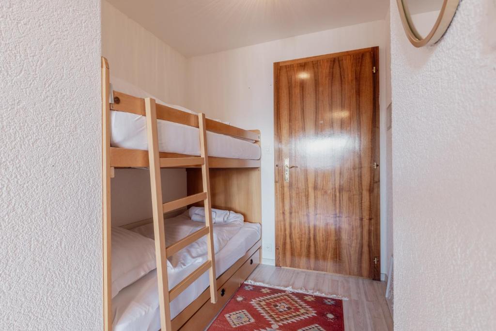 Postel nebo postele na pokoji v ubytování Chaleureux studio proche des pistes de ski