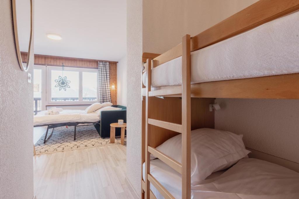 Postel nebo postele na pokoji v ubytování Chaleureux studio proche des pistes de ski
