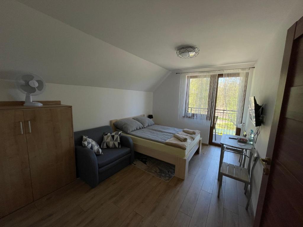 Posteľ alebo postele v izbe v ubytovaní Apartament Rybical - POKOJE