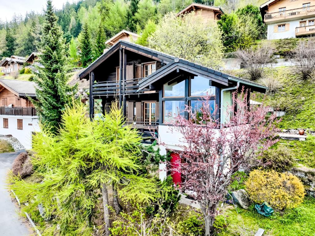 an aerial view of a house with trees at Chalet Valet de Coeur by Interhome in Nendaz