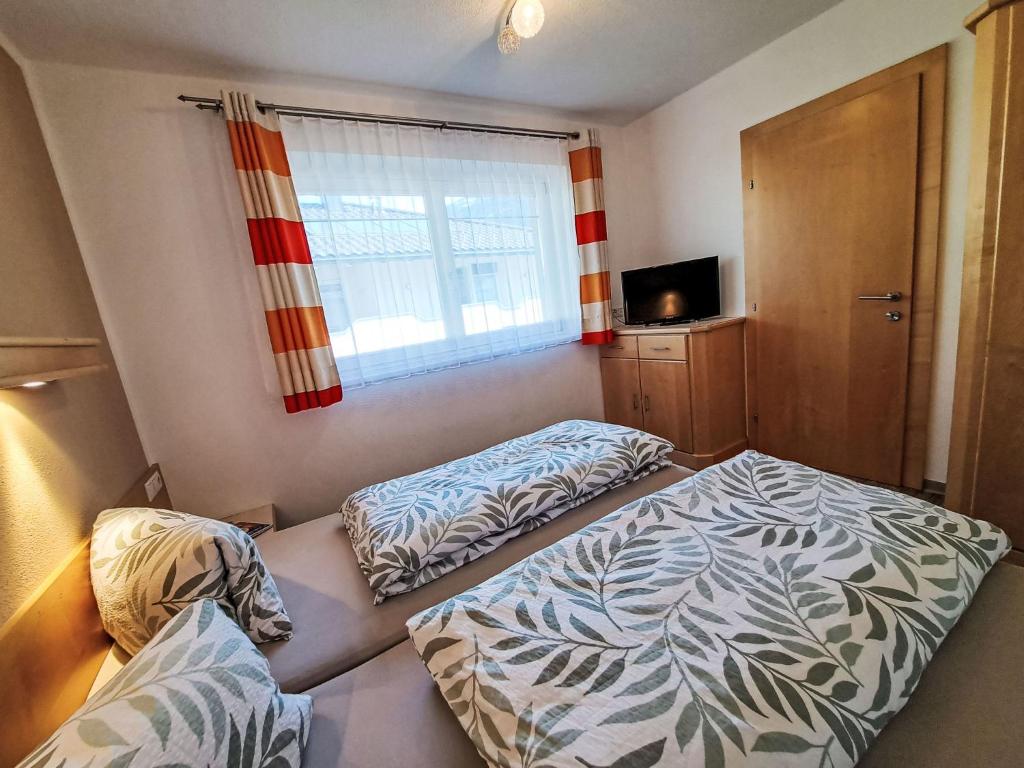 Posteľ alebo postele v izbe v ubytovaní Apartment Regina by Interhome