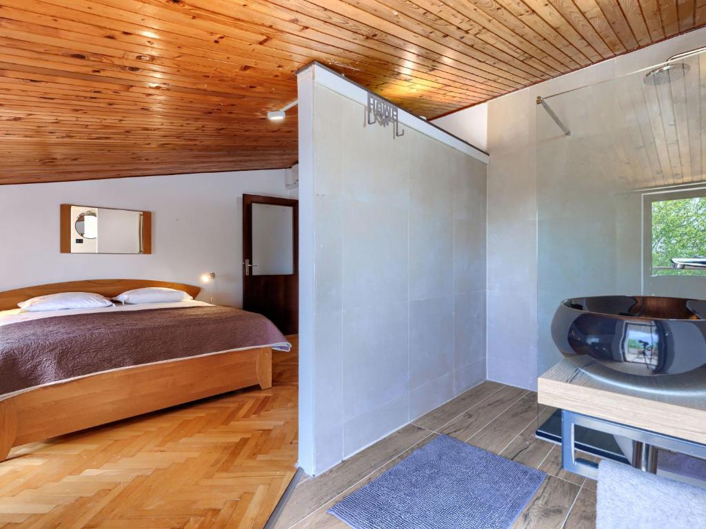 Postel nebo postele na pokoji v ubytování Holiday Home Lancin by Interhome