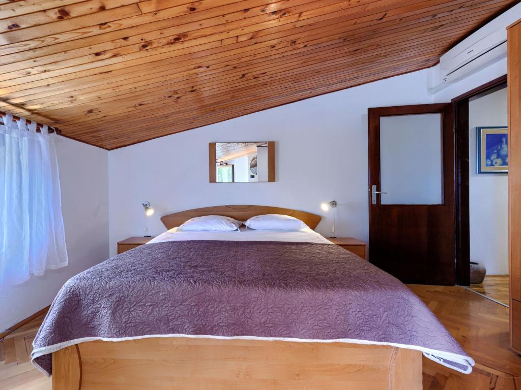 Postel nebo postele na pokoji v ubytování Holiday Home Lancin by Interhome