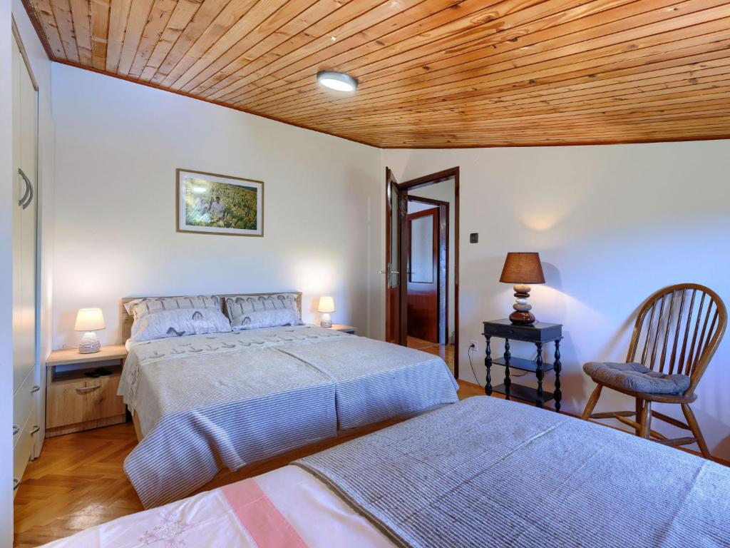 Postel nebo postele na pokoji v ubytování Holiday Home Lancin by Interhome