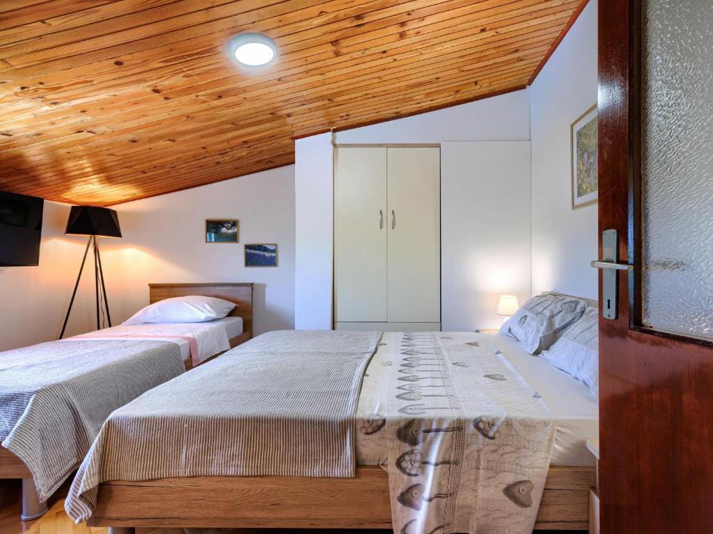 Postel nebo postele na pokoji v ubytování Holiday Home Lancin by Interhome