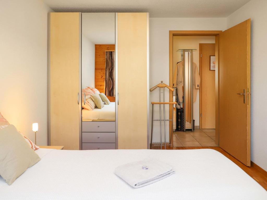 Postel nebo postele na pokoji v ubytování Apartment Belmi by Interhome
