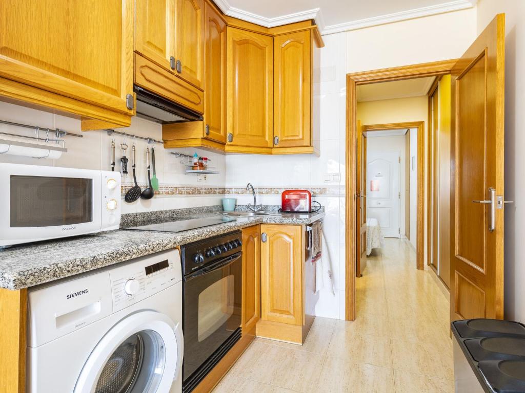 A kitchen or kitchenette at Apartment Grimaca-2 by Interhome