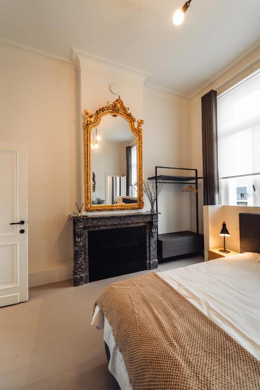 Postel nebo postele na pokoji v ubytování Luxeverblijf B&B het Wevershuis