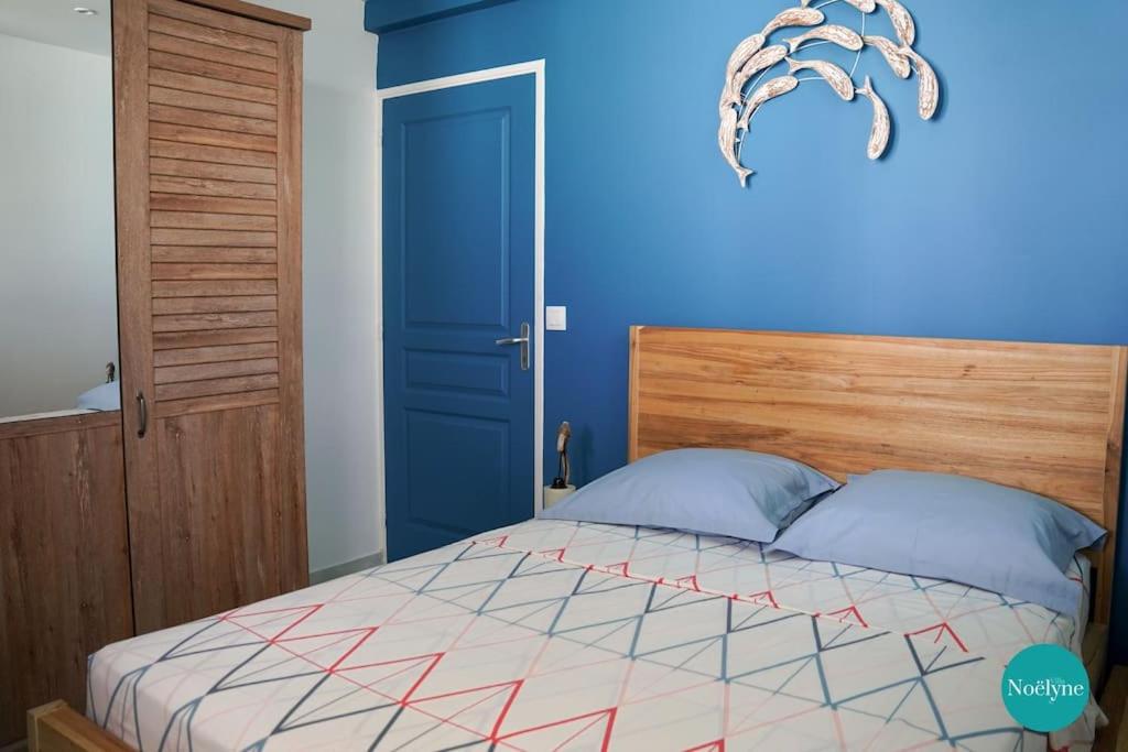 Postel nebo postele na pokoji v ubytování Villa Noëlyne