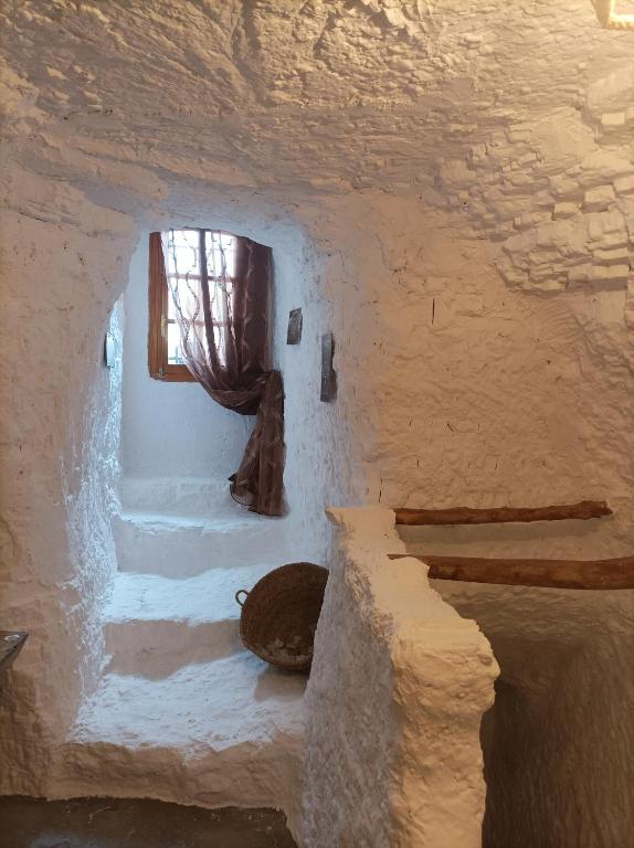 Postel nebo postele na pokoji v ubytování Cueva la Trapera