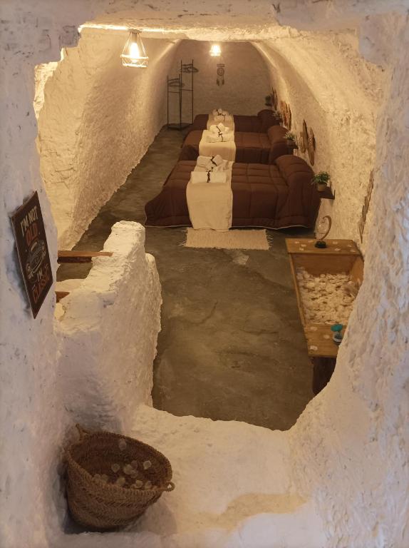 Postel nebo postele na pokoji v ubytování Cueva la Trapera