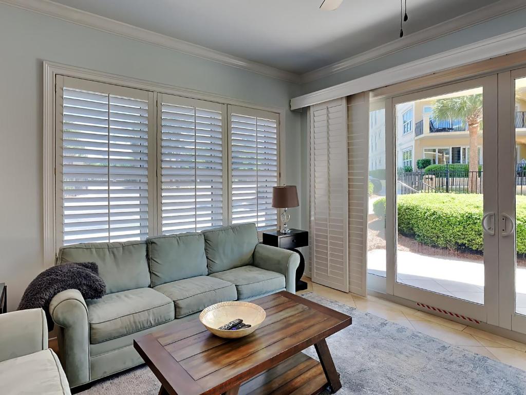a living room with a couch and a table at Adagio 101f in Santa Rosa Beach