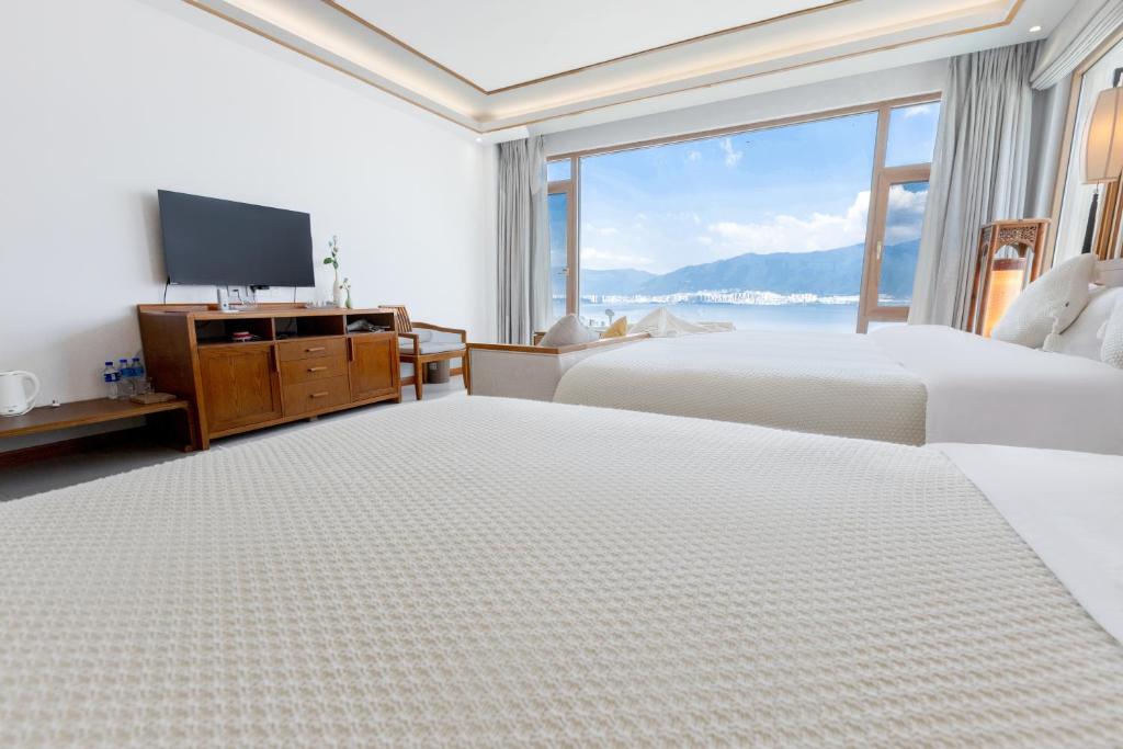 Postel nebo postele na pokoji v ubytování Dali Dare Sea View Gueshouse