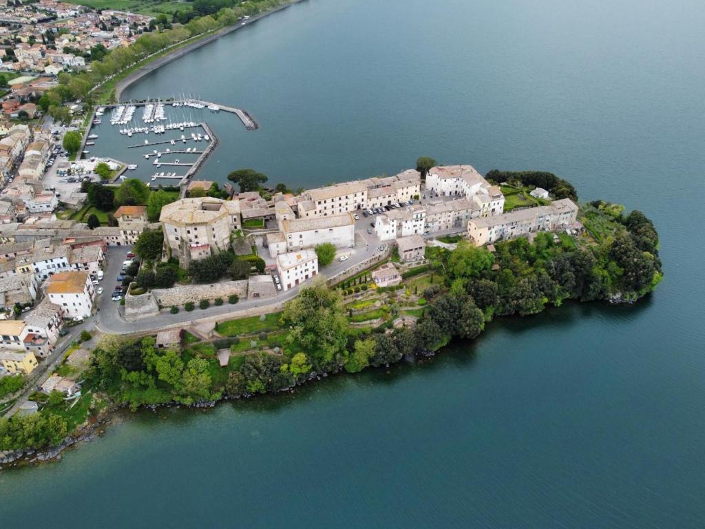 an aerial view of an island in the water at la rocca sul lago in Capodimonte